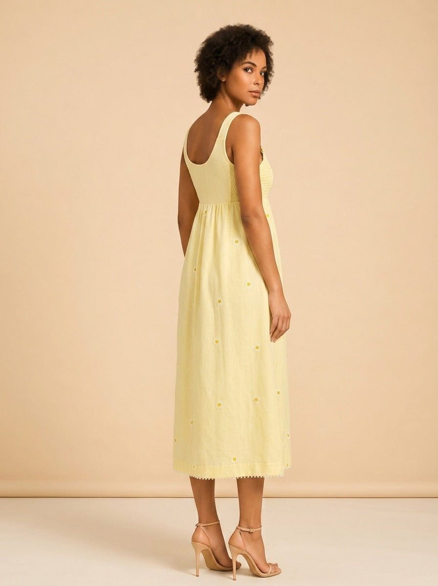 EMILY DRESS IN SOFT BUTTER YELLOW model_over_shoulder