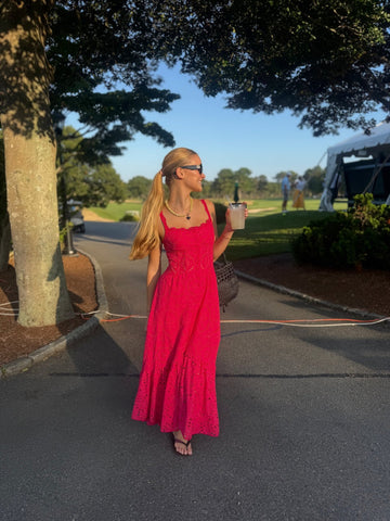 Rent with Reve customer in a red maxi dress