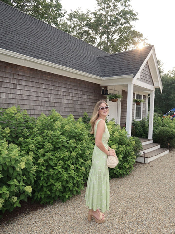 Rent with Reve customer in a sage green dress