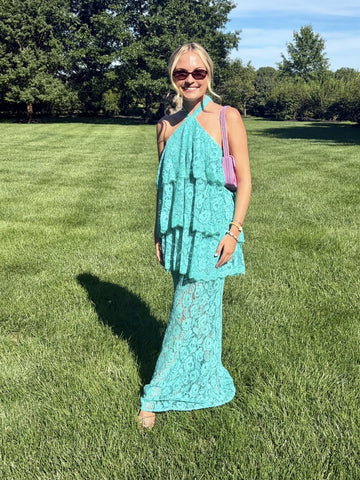 Rent with Reve customer in a turquoise lace dress